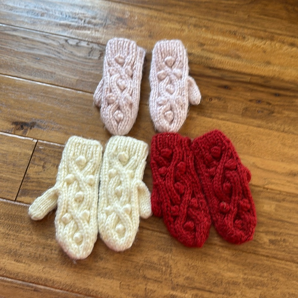 3 Pairs of Mittens. Cream, Light Pink, Red.